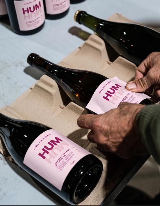 HUM 750ml bottles in a cardboard tray